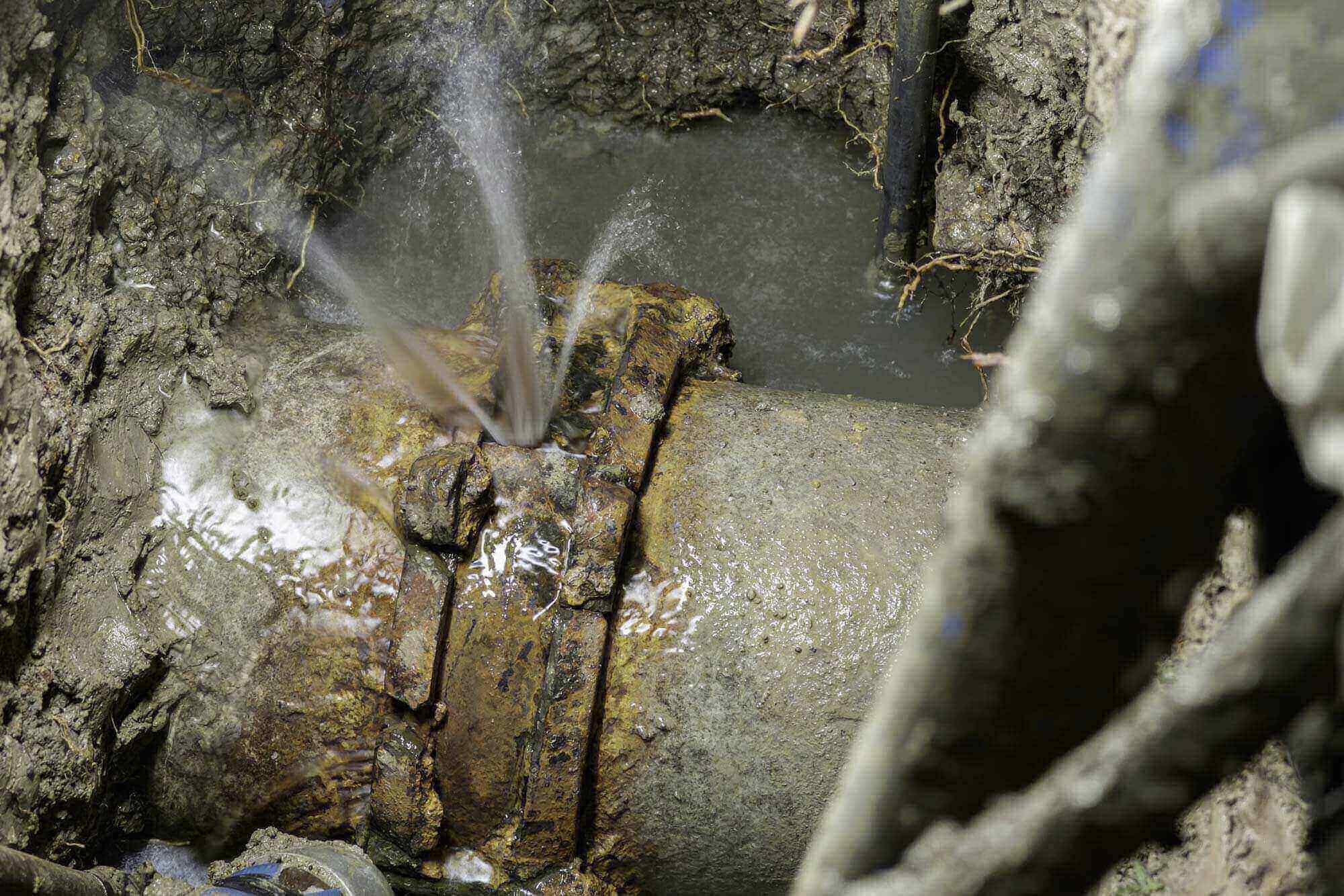 Located water main break under a campus roadway